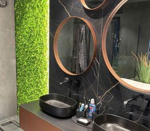 Green moss wall in a luxury bathroom