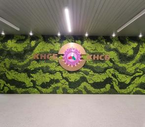 Green walls in the entrance lobby of KNSB