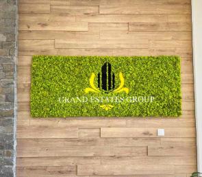 Moss board with logo of Grand Estate Group